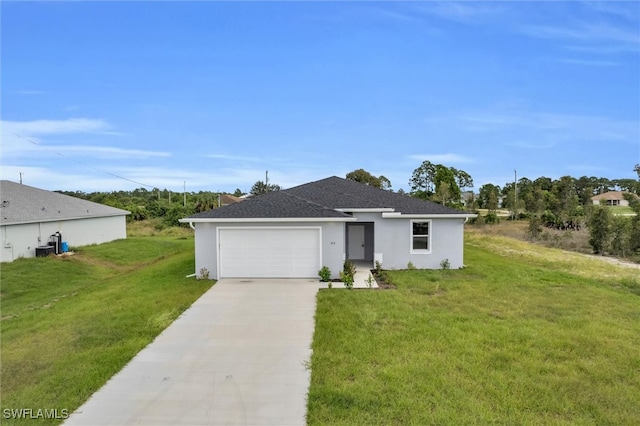 ranch-style house featuring a garage and a front lawn