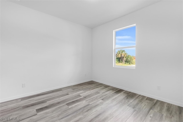 unfurnished room featuring light hardwood / wood-style flooring