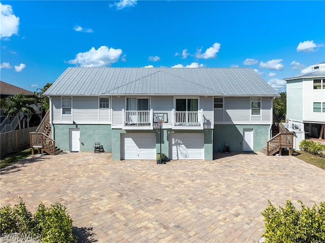 rear view of house with a garage