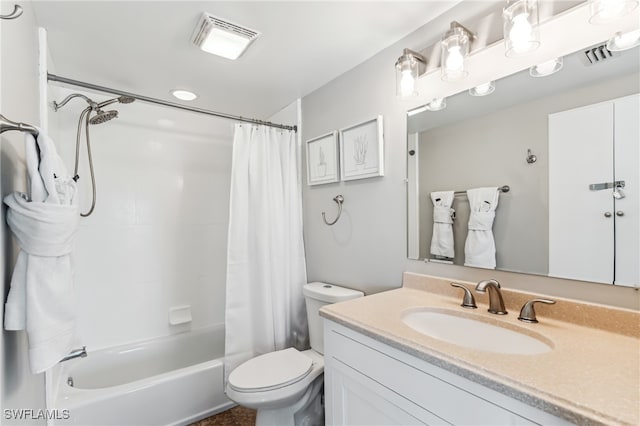 full bathroom featuring shower / tub combo with curtain, vanity, and toilet