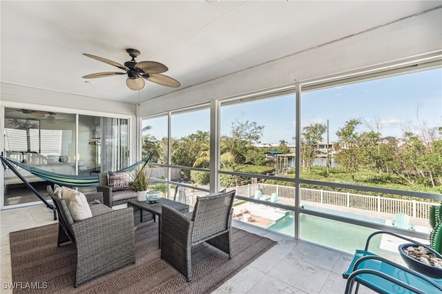 sunroom / solarium with ceiling fan