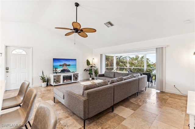 living room featuring ceiling fan and high vaulted ceiling