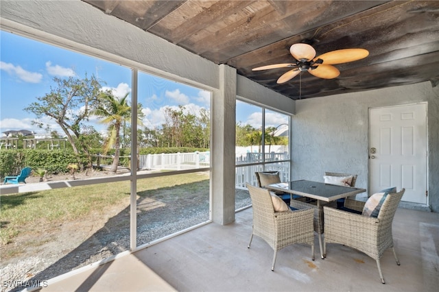 sunroom with wooden ceiling and ceiling fan