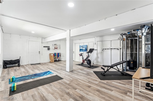 exercise area with hardwood / wood-style flooring