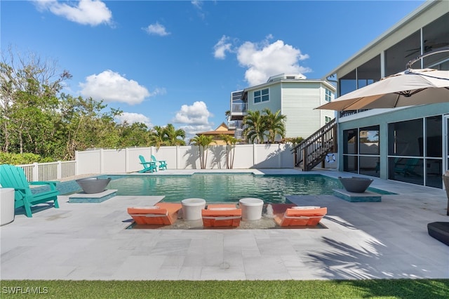 view of swimming pool featuring a patio area