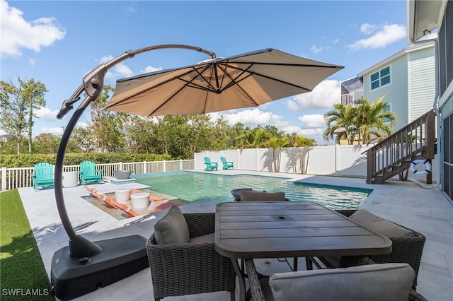 view of swimming pool with a patio area