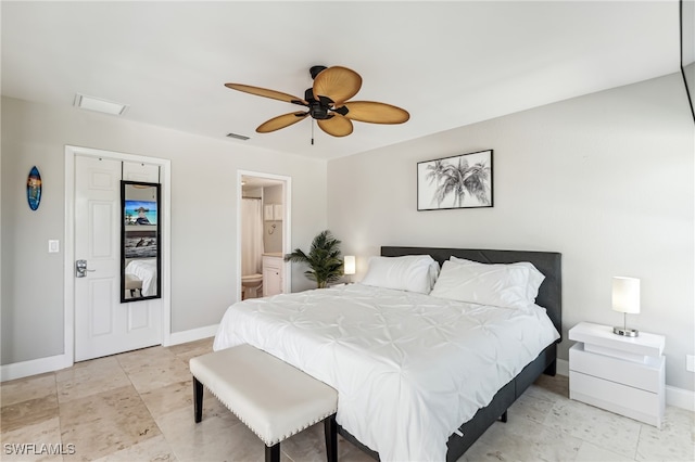 bedroom with ensuite bathroom and ceiling fan