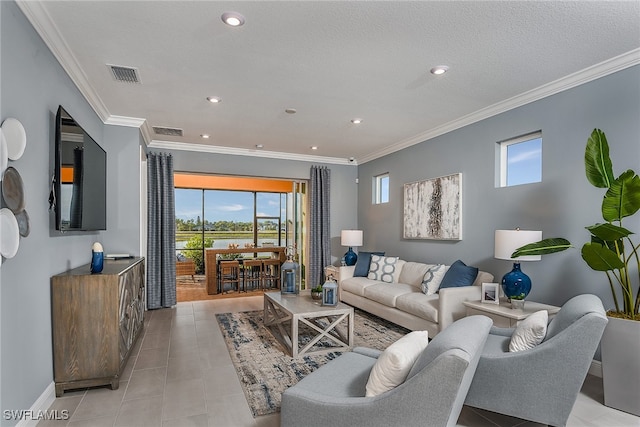 tiled living room with a textured ceiling and crown molding