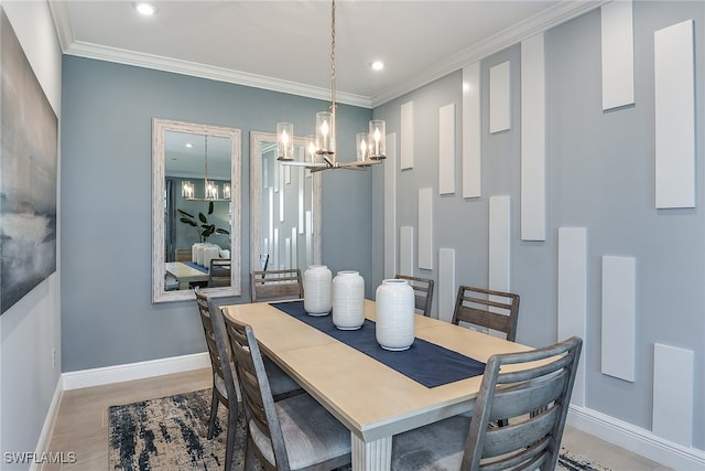 dining area featuring hardwood / wood-style flooring and crown molding