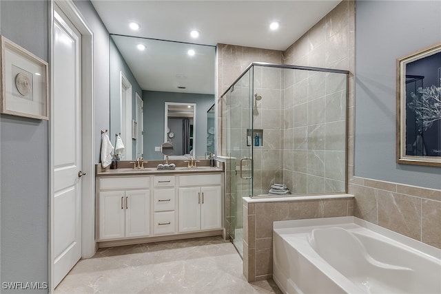 bathroom with tile walls, vanity, tile patterned floors, and separate shower and tub