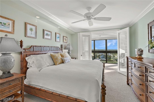 carpeted bedroom with crown molding and ceiling fan