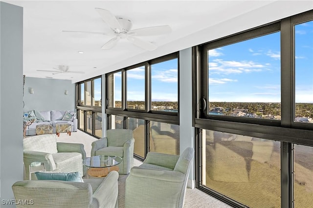 sunroom with ceiling fan