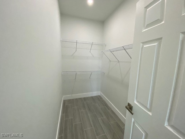 walk in closet featuring wood-type flooring