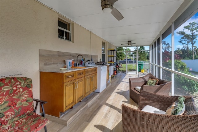 sunroom featuring sink