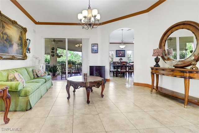 tiled living room featuring ceiling fan with notable chandelier and ornamental molding