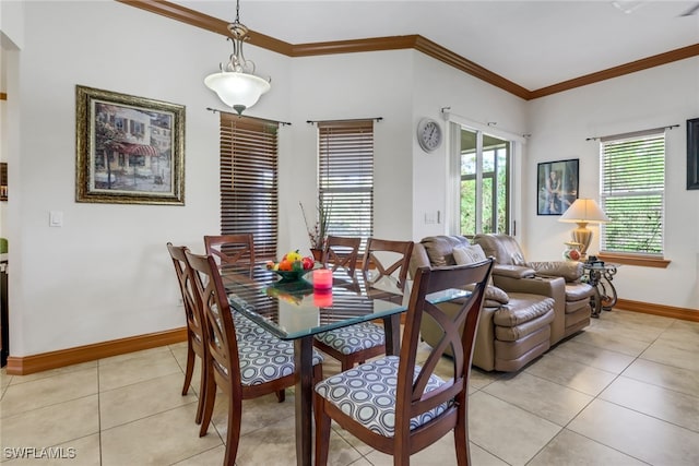 tiled dining space featuring ornamental molding