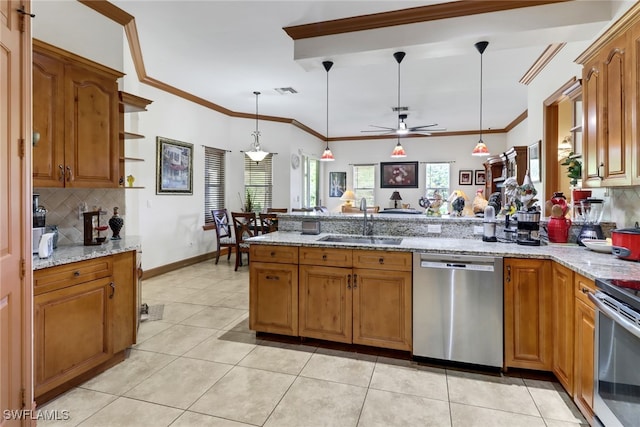 kitchen featuring tasteful backsplash, stainless steel appliances, pendant lighting, sink, and ceiling fan