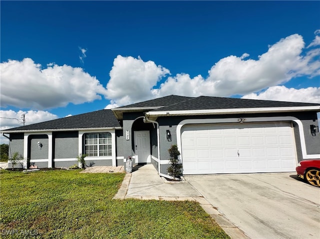 ranch-style house featuring a garage and a front lawn