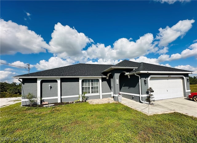 single story home with a garage and a front lawn