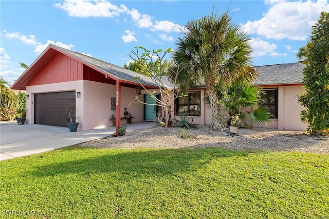 ranch-style home featuring a front yard and a garage