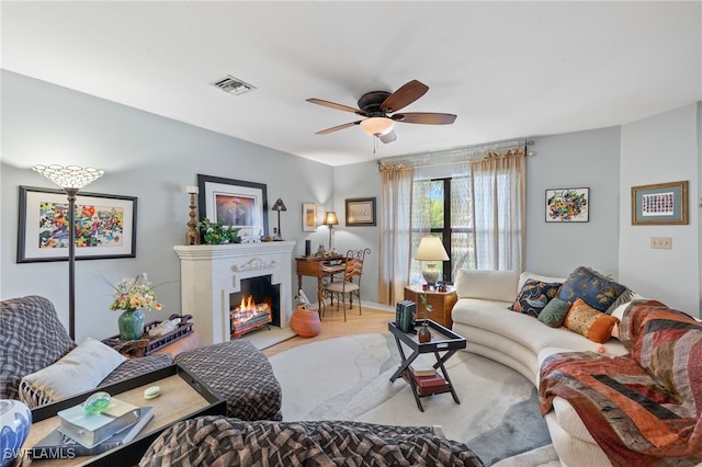 living room featuring hardwood / wood-style floors and ceiling fan