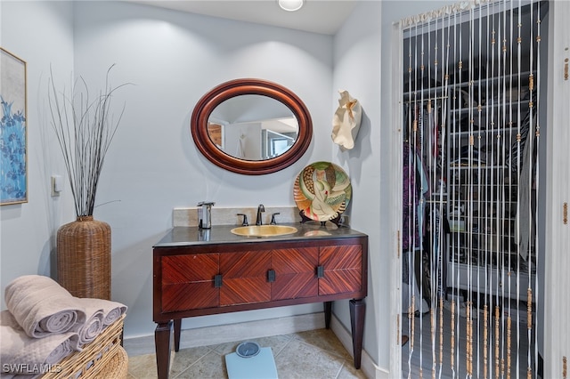 bathroom with tile patterned flooring and vanity