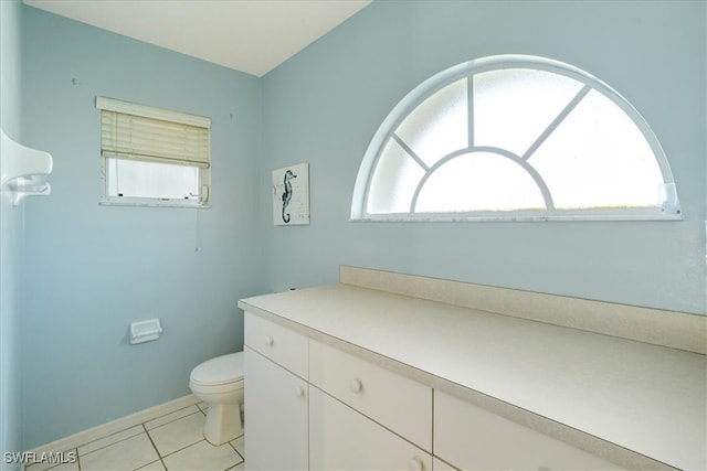 bathroom with tile patterned floors, vanity, and toilet