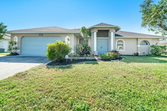 ranch-style home with a front yard and a garage