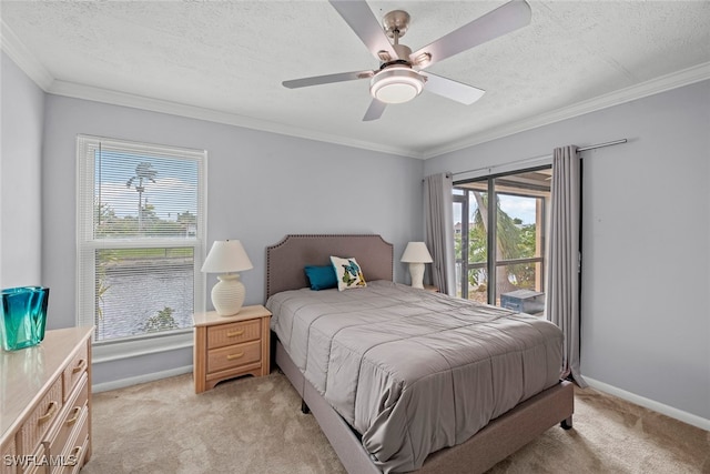 bedroom with a textured ceiling, light colored carpet, and ceiling fan