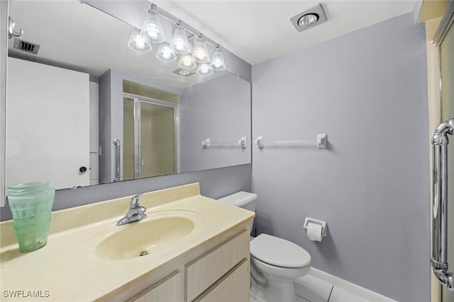 bathroom with vanity, an enclosed shower, toilet, and tile patterned flooring