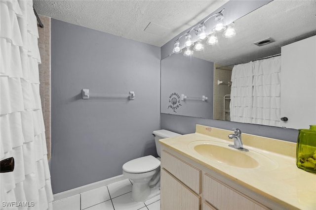 bathroom featuring tile patterned floors, a shower with shower curtain, vanity, toilet, and a textured ceiling