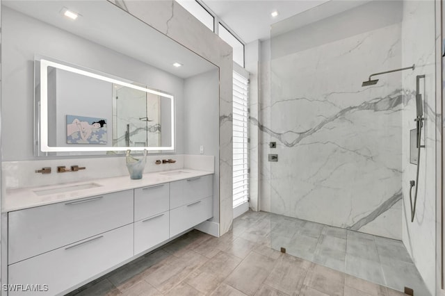 bathroom featuring vanity and tiled shower