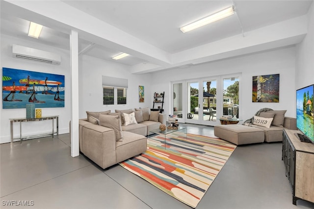 living room with concrete flooring, a wall unit AC, and french doors