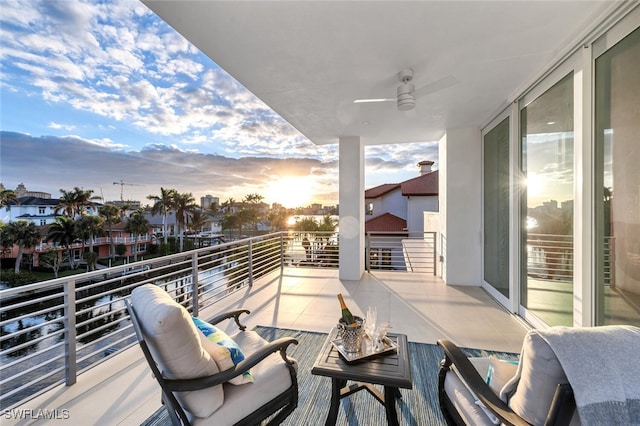 balcony at dusk with ceiling fan