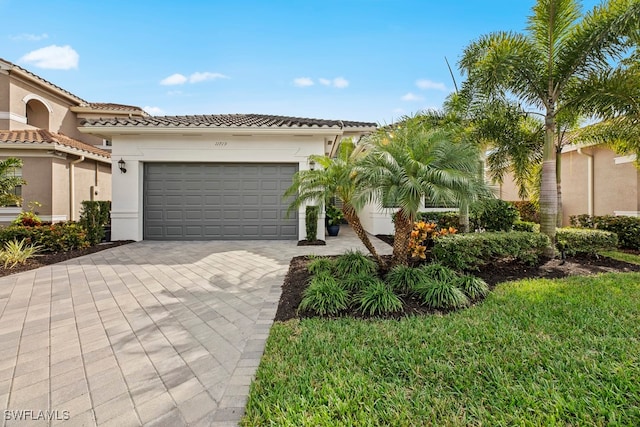 mediterranean / spanish-style home featuring a garage