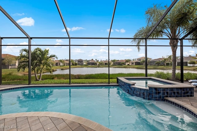 view of pool with a lanai, a water view, and an in ground hot tub