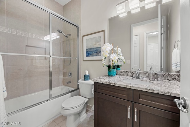 full bathroom with toilet, vanity, combined bath / shower with glass door, and tile patterned floors