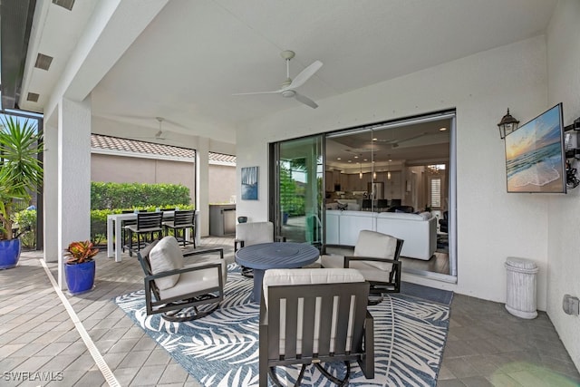 view of patio featuring an outdoor hangout area and ceiling fan