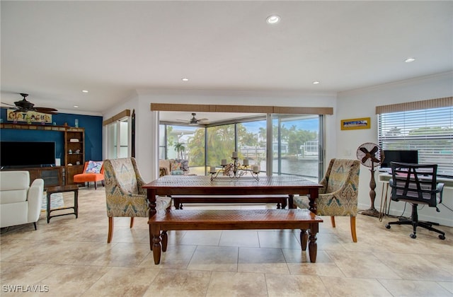 dining area featuring light tile patterned floors, crown molding, and ceiling fan