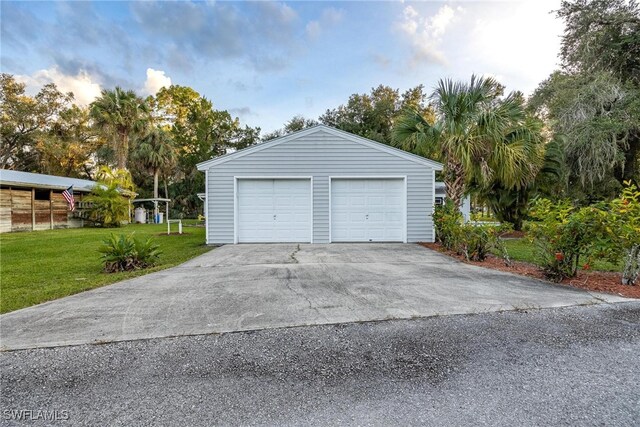 garage featuring a yard