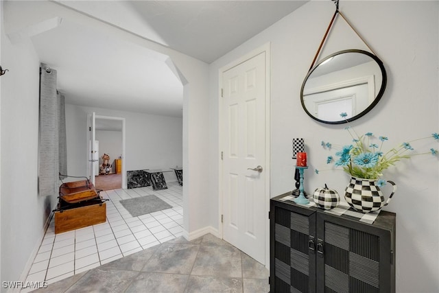 hallway featuring light tile patterned floors