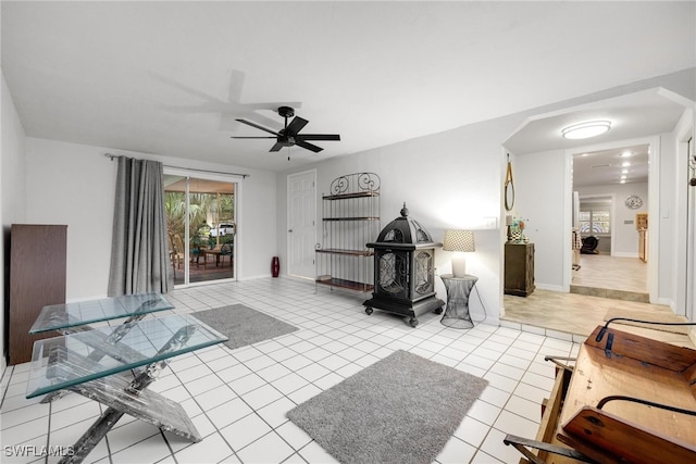 interior space featuring ceiling fan and light tile patterned floors