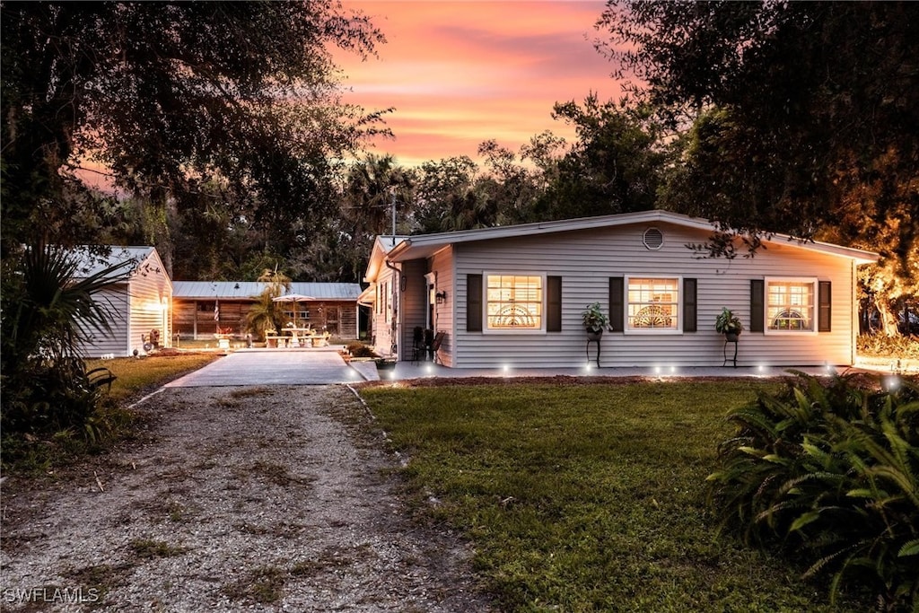 view of front of house with a yard