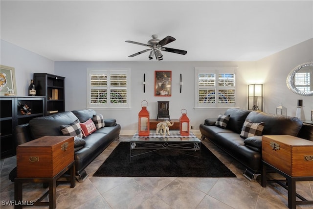 tiled living room featuring ceiling fan and a healthy amount of sunlight