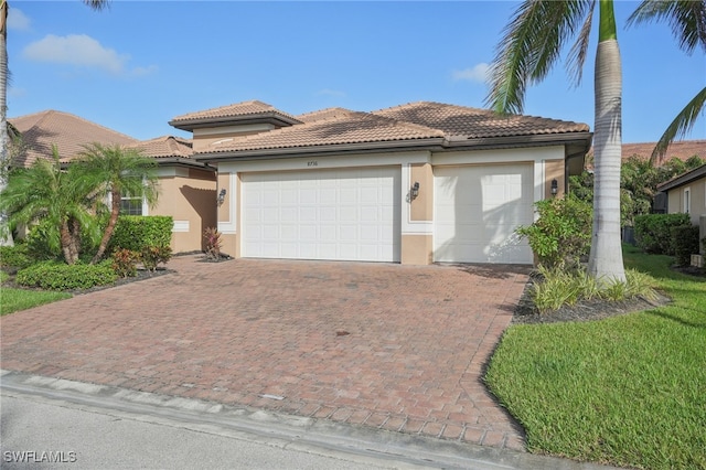 mediterranean / spanish-style house featuring a garage