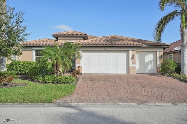 mediterranean / spanish-style home featuring a garage