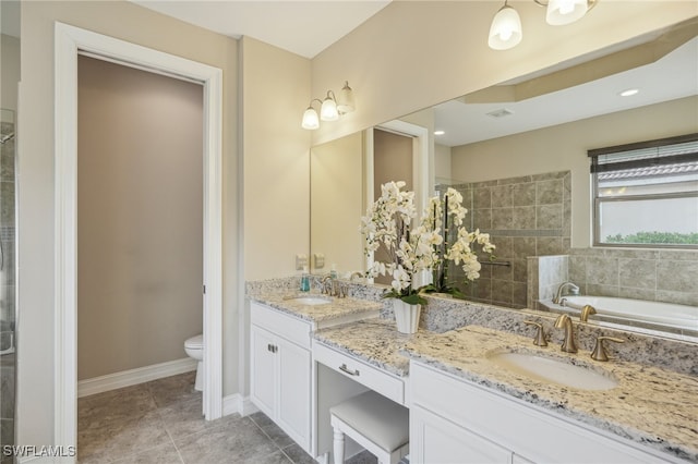 full bathroom featuring toilet, shower with separate bathtub, vanity, and tile patterned floors