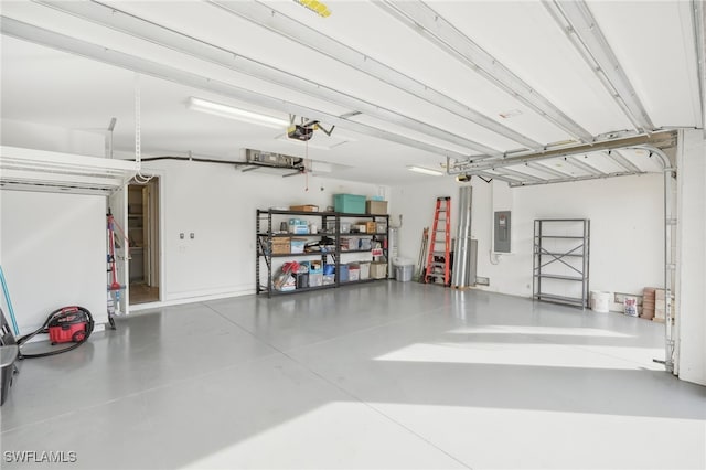 garage with electric panel and a garage door opener