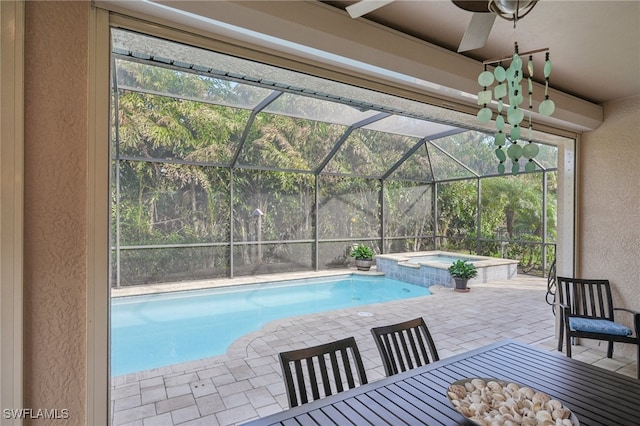 view of pool featuring a patio, ceiling fan, an in ground hot tub, and a lanai