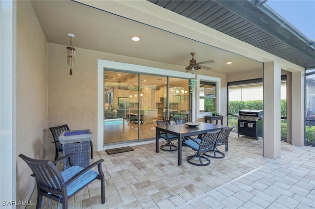 view of patio with grilling area and ceiling fan